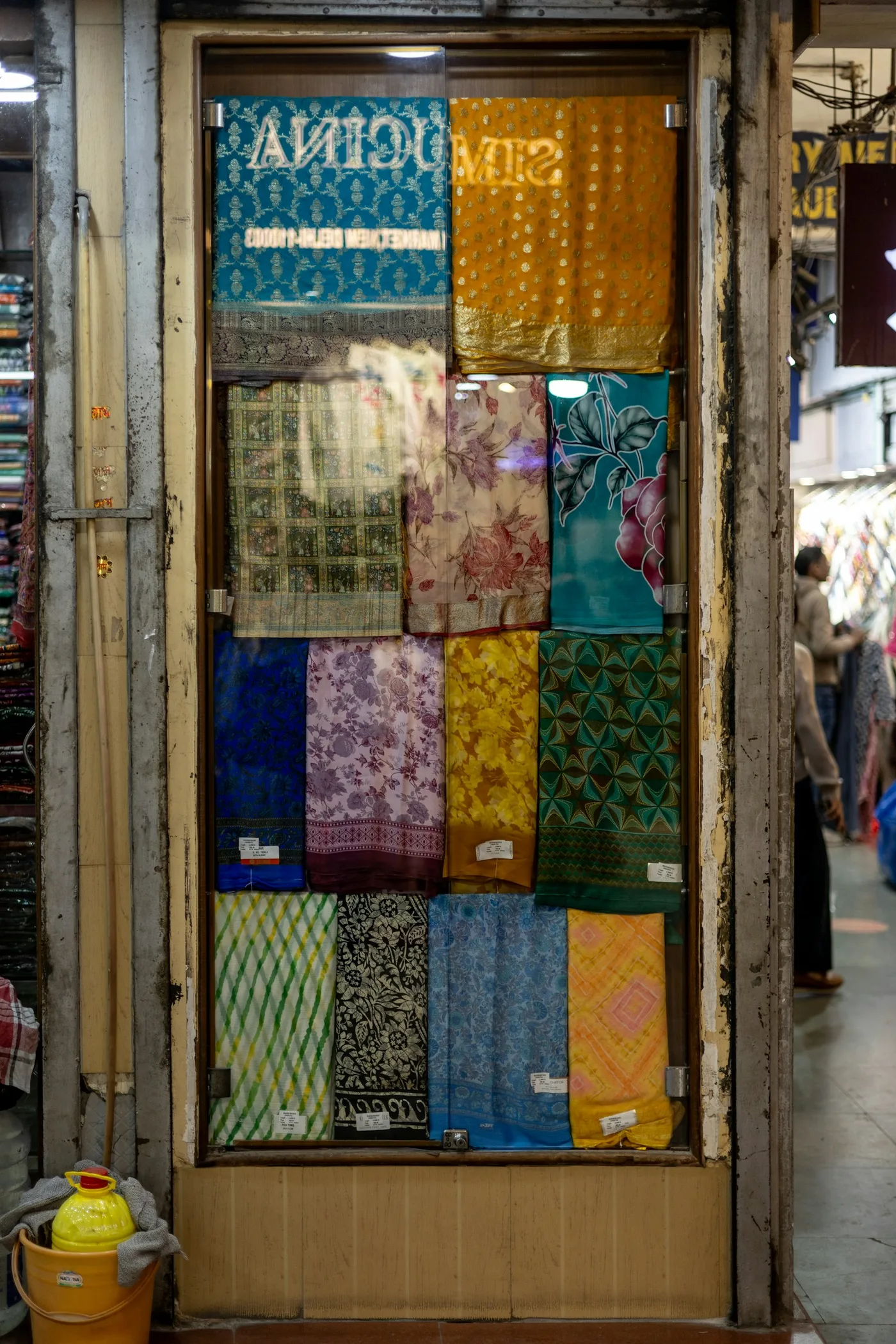 Display of colorful fabrics at an Indian market