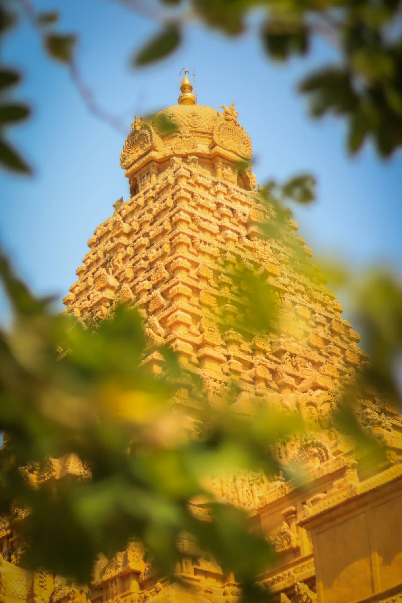 Tower of an Indian temple (gopuram) against the sky
