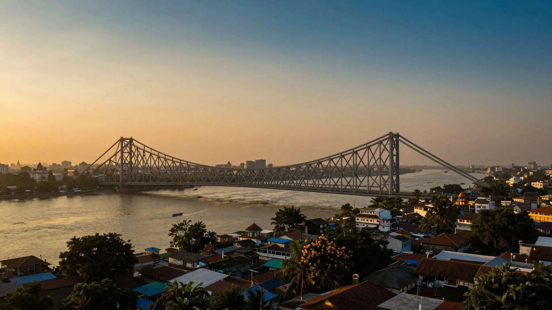 The Howrah Bridge over the Hooghly River in Calcutta at sunset
